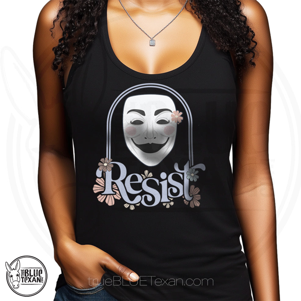 Black tank top with a female guy fawkes mask graphic and 'Resist' with flowers