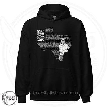 Beto: Man in the Arena Texas Unisex Hoodie featuring Beto O'Rourke and the shape of the state of Texas says "Beto is still showing up for Texas & putting in the work in black