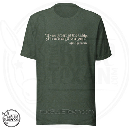 "If you aren't at the table, you are on the menu Ann Richards" quote premium tshirt heather green