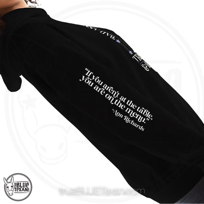Bad Ass, Liberal, Feminist, Trailblazer, Hellraiser. Texas Governor Ann Richards premium unisex hoodie sweatshirt in black  The arm features the quote "If you aren't at the table. you are on the menu."