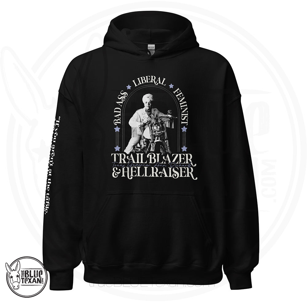 Bad Ass, Liberal, Feminist, Trailblazer, Hellraiser. Texas Governor Ann Richards premium unisex hoodie sweatshirt in black  The arm features the quote "If you aren't at the table. you are on the menu."