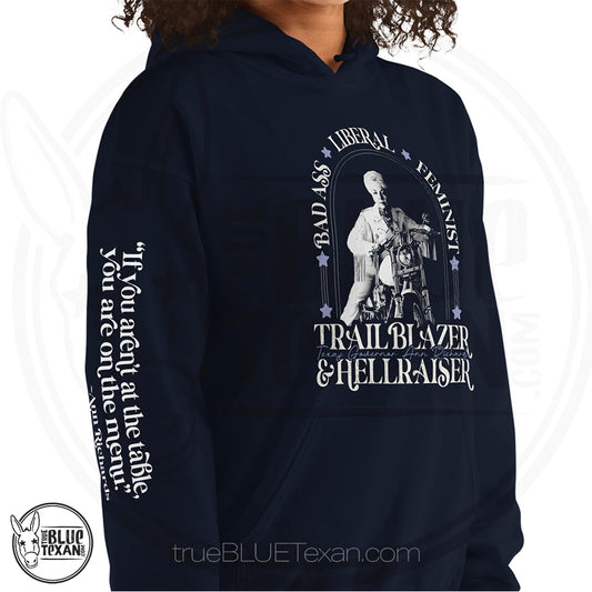 Bad Ass, Liberal, Feminist, Trailblazer, Hellraiser. Texas Governor Ann Richards premium unisex hoodie sweatshirt in navy. The arm features the quote "If you aren't at the table. you are on the menu."