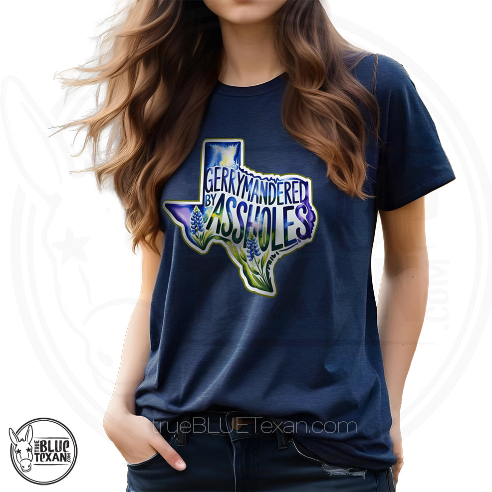 premium women's tshirt with  the shape of Texas featuring Bluebonnet flowers that says "Gerrymandered by Assholes" in navy